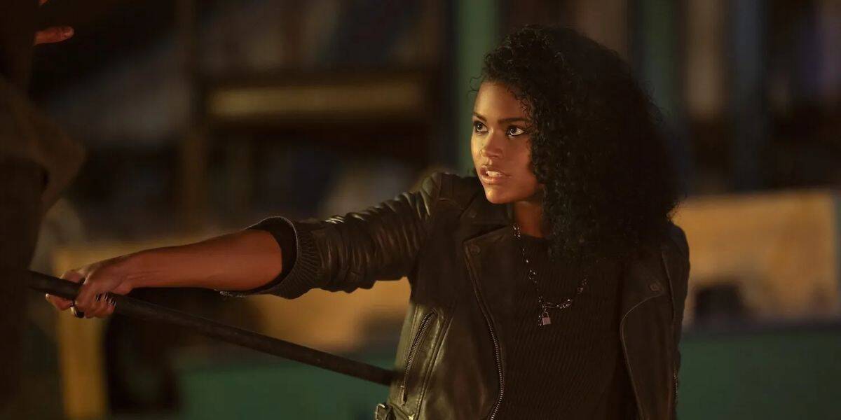 Thalia holds out a weapon