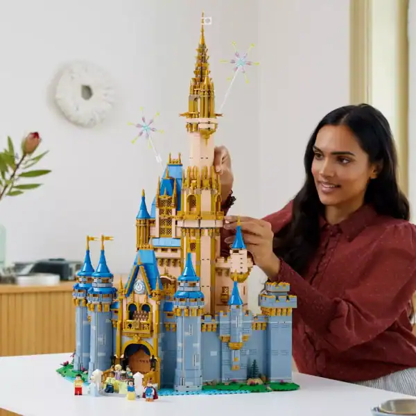 A Disney fan constructs the iconic LEGO Cinderella Castle at home—a must-have set for park lovers before it retires.
