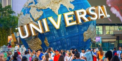guests gather around spinning globe at Universal Orlando Resort