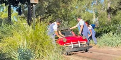 A derailed vehicle on Autopia.