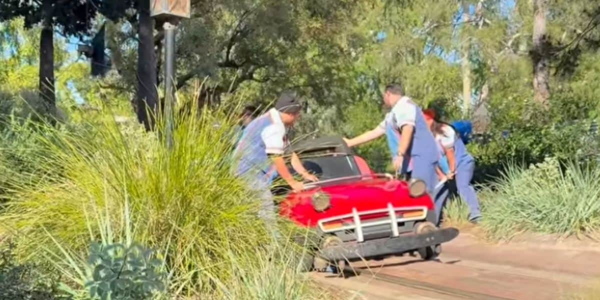 A derailed vehicle on Autopia.