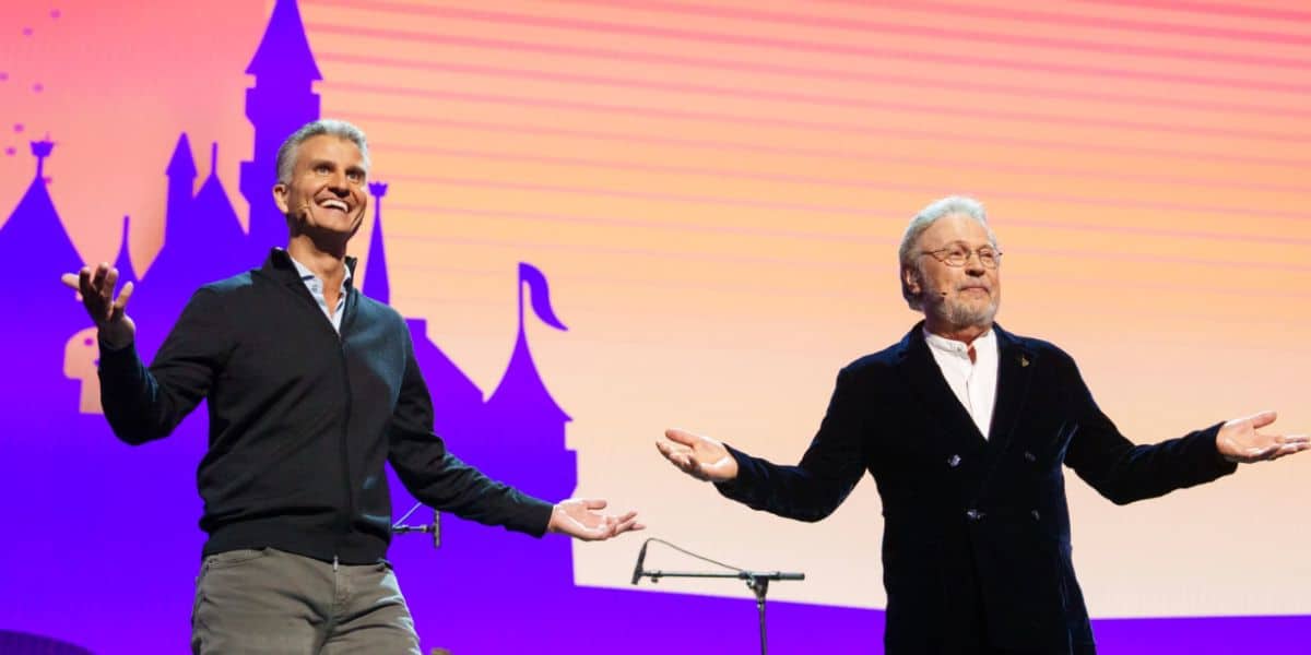 Josh D'Amaro and Billy Crystal on stage at D23 convention 2024