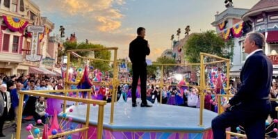 Josh D’Amaro addresses Disney fans in Disneyland as Bob Iger stands nearby