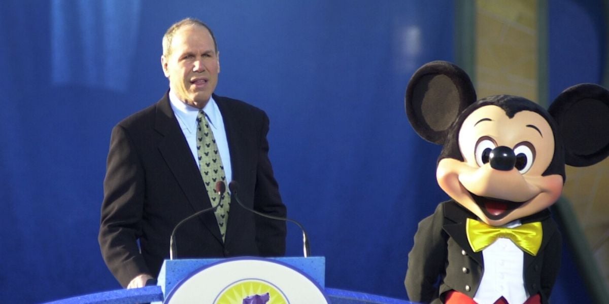 Michael Eisner with Mickey Mouse at the opening of Disney's California Adventure Park