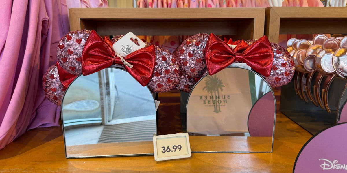 Sparkling red Minnie Mouse ear headbands with sequins and bows line the shelves at Disney Parks, priced at $36.99.