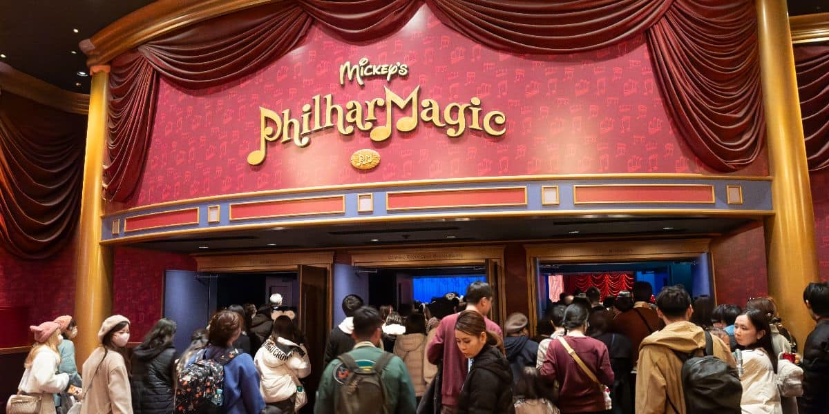 Guests wait to enter the theater of Mickey's Philharmagic