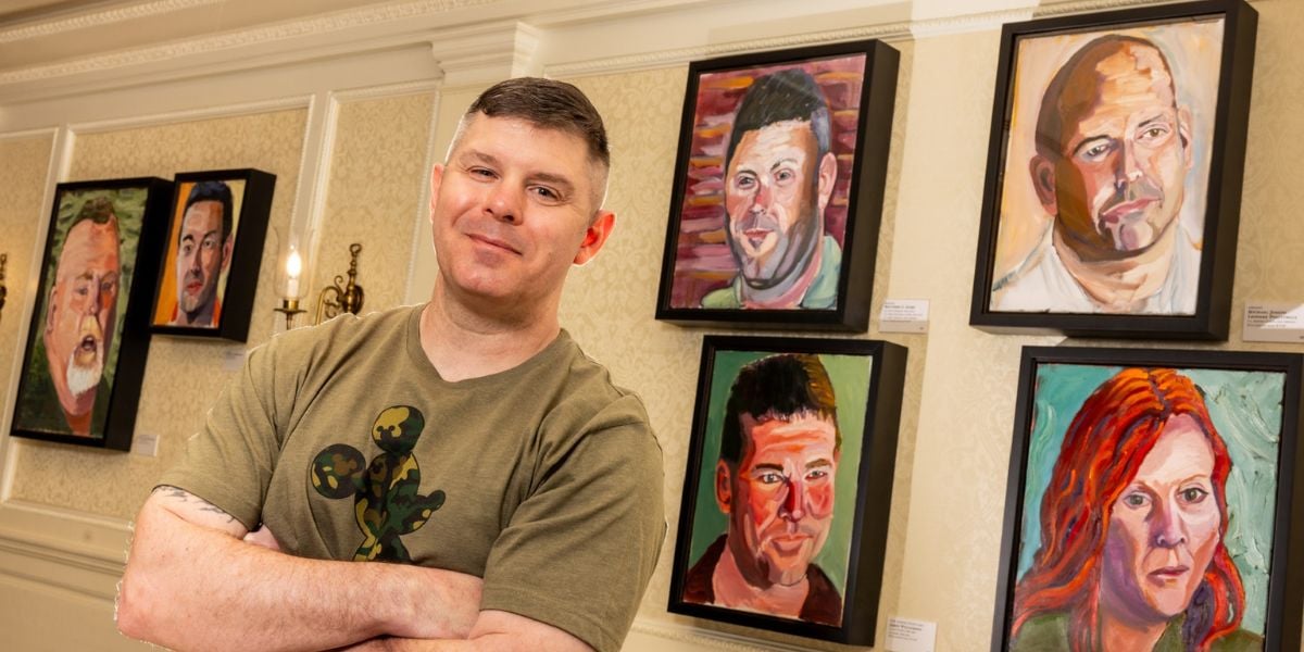 A veteran with the Portraits of Courage exhibit at EPCOT
