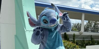 Stitch on stage in Tomorrowland at Magic Kingdom Park.