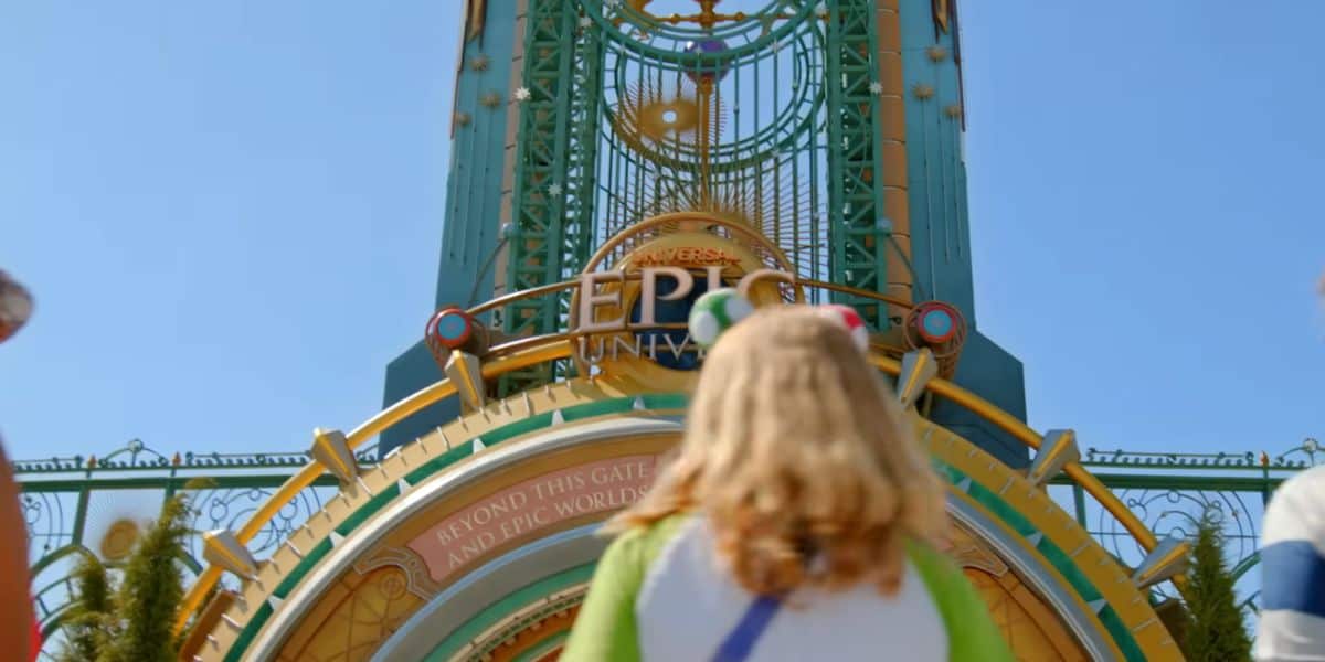 guest in front of entrance to Universal's Epic Universe theme park