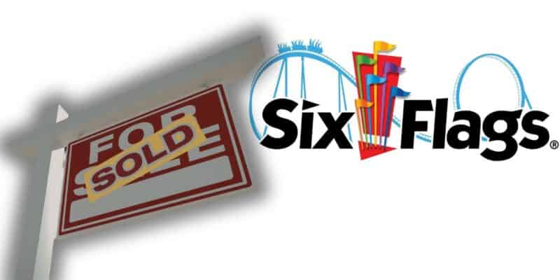 Six Flags logo with coaster tracks in the background, and a "For Sale" sign now marked "Sold," signaling park ownership change.