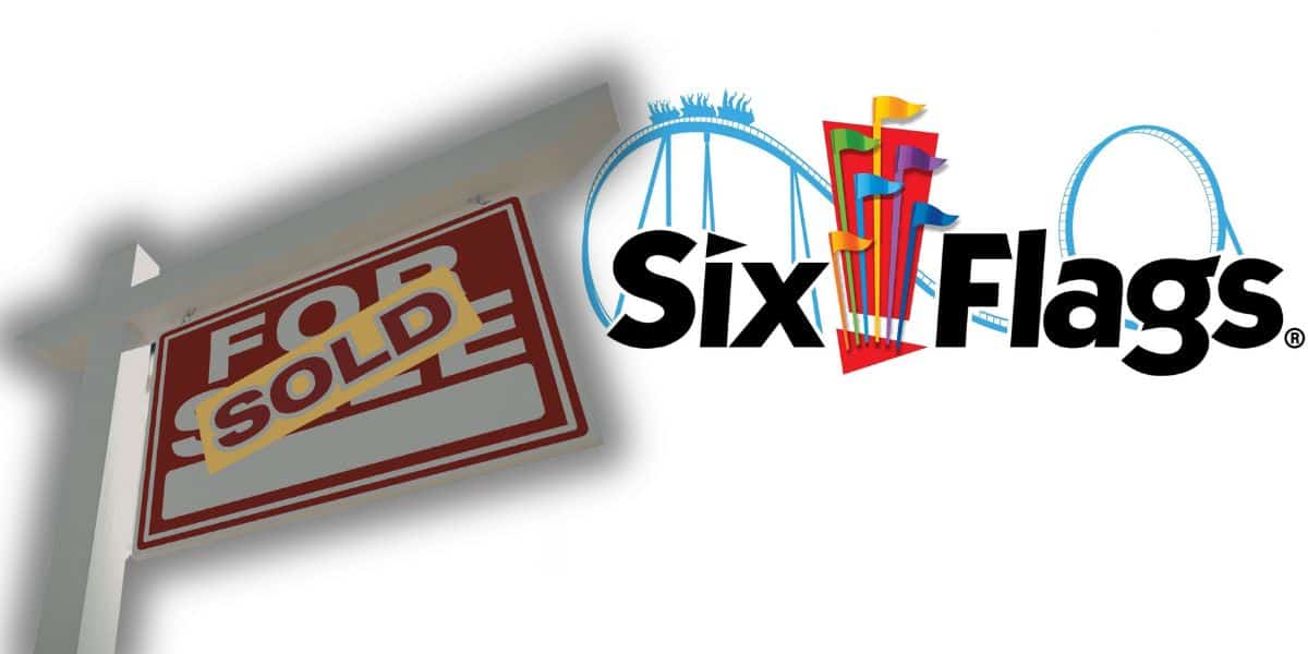 Six Flags logo with coaster tracks in the background, and a "For Sale" sign now marked "Sold," signaling park ownership change.
