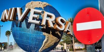The iconic Universal Studios globe with a bold "no entry" sign blocking the main entrance at Universal Orlando Resort as a new ban policy is now in place.