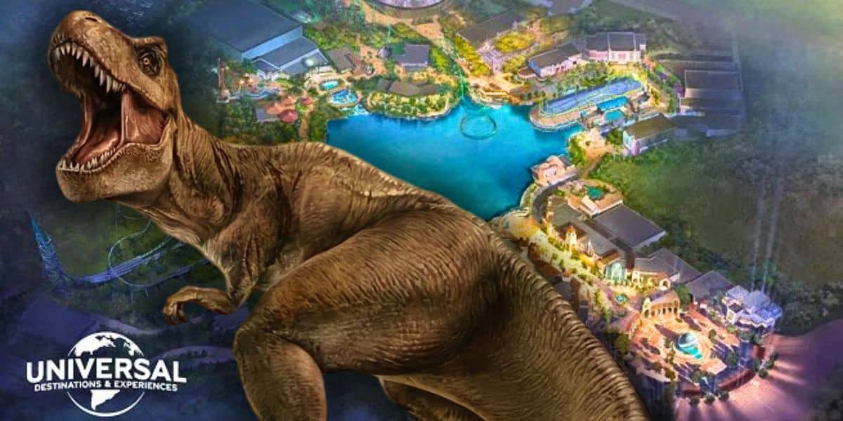 The fierce Jurassic Park T. rex roars in front of a colorful Universal Studios theme park map with the Universal logo nearby. Universal Bedford, United Kingdom.