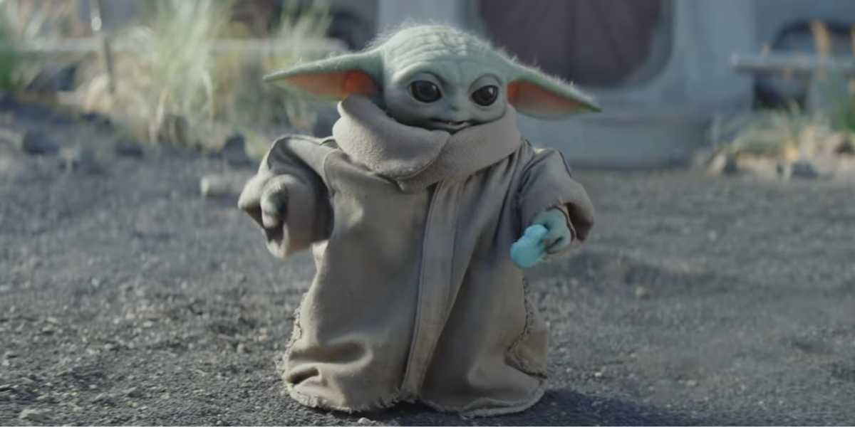 Grogu eating a cookie in 'The Mandalorian and Grogu'