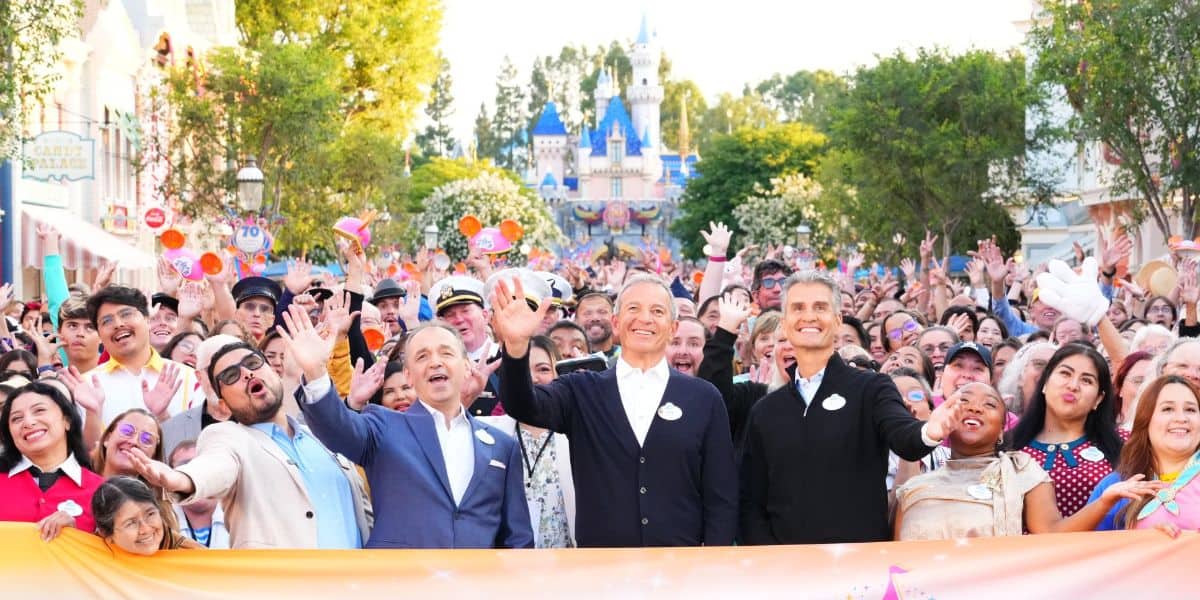 Bob Iger and Josh D'Amaro in front of Sleeping Beauty Castle