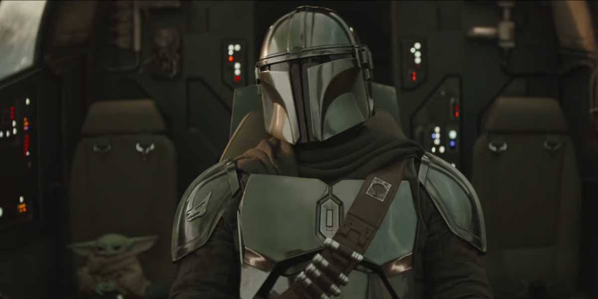 Grogu (L) and Din Djarin (R) in the Razor Crest cockpit in 'The Mandalorian and Grogu'