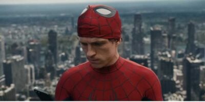 Peter Parker (Tom Holland) unmasked with New York in the background