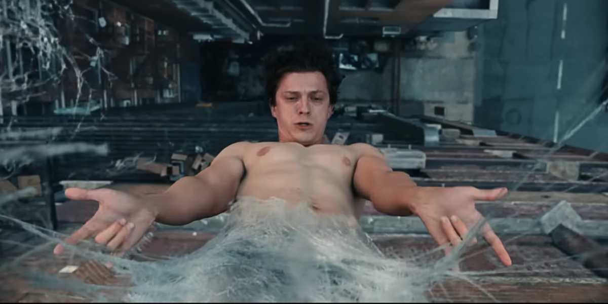 Shirtless Peter Parker (Tom Holland) waking up in an organic web in 'Brand New Day'
