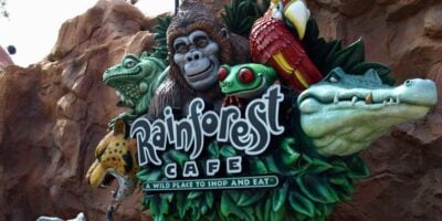 Rainforest Cafe sign at Disney Resort with animal mascots—gorilla, parrot, frog, leopard, alligator—a cherished lost icon. Disneyland Paris Rainforest Cafe