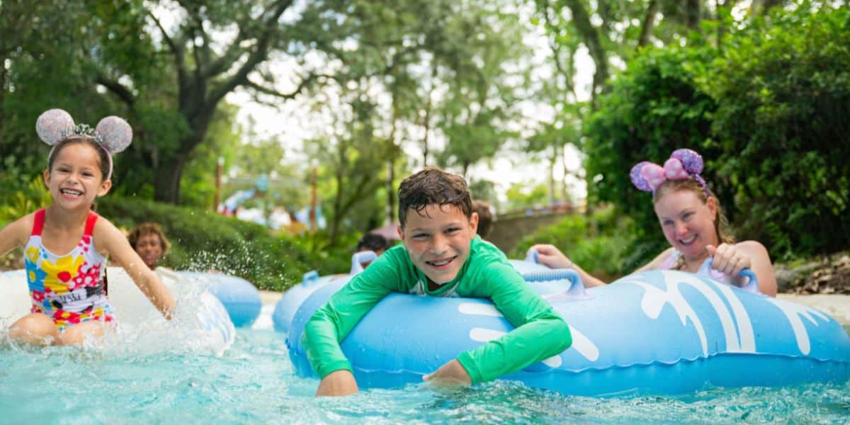 family in lazy river at disney world hotel