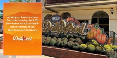 Dollywood entrance sign announces adjusted park hours and limited attractions because of chilly winter weather.