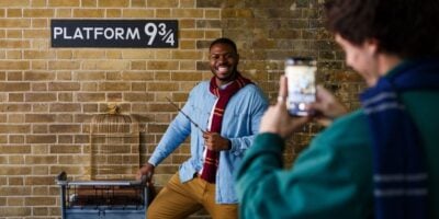 Guests posing for a photo at the Harry Potter Shop King's Cross