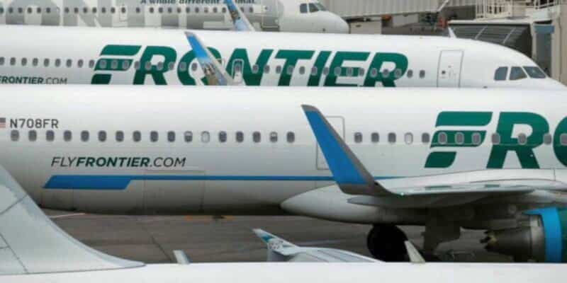 Frontier Airlines jets, decked in vibrant green and blue, await guests at the gate like thrilling rides ready to launch. Frontier Airlines Denver incident.