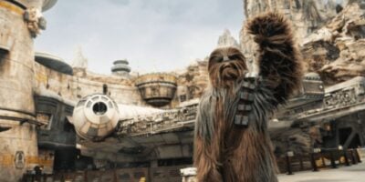 Chewy in front of Millenium Falcon: Smuggler's Run in Disney's Galaxy's Edge