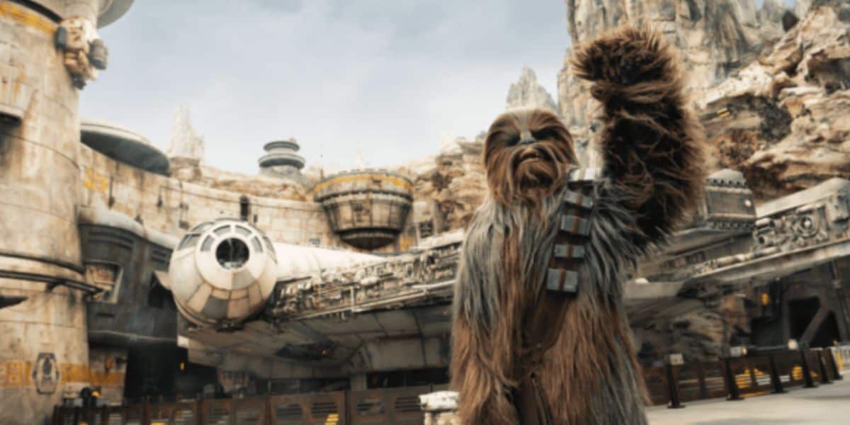 Chewy in front of Millenium Falcon: Smuggler's Run in Disney's Galaxy's Edge