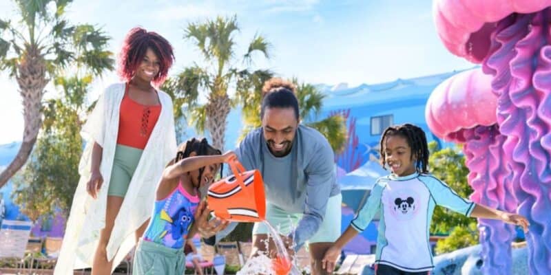 a family plays in finding nemo pool at disney's art of animation resort