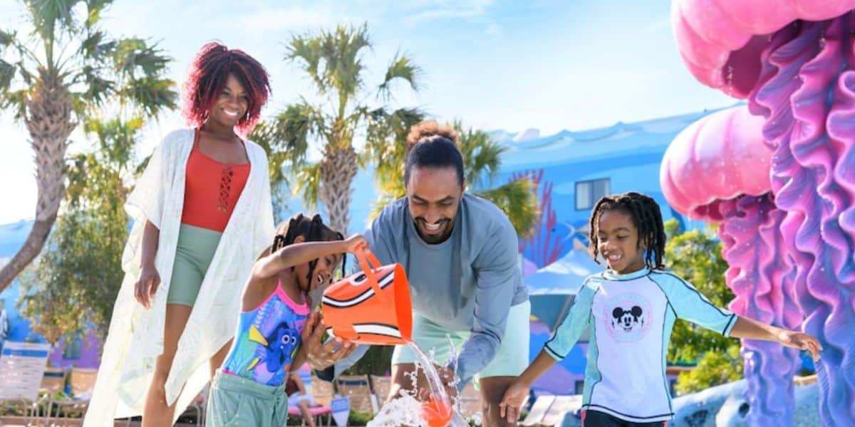 a family plays in finding nemo pool at disney's art of animation resort
