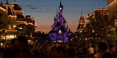 Nighttime on Main Street, U.S.A., and the walkway to Sleeping Beauty Castle at Disneyland Paris