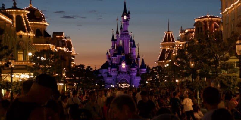 Nighttime on Main Street, U.S.A., and the walkway to Sleeping Beauty Castle at Disneyland Paris