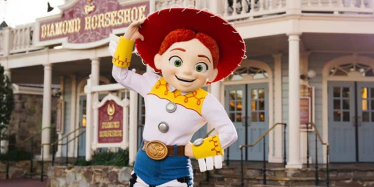 Jessie in front of Magic Kingdom's Diamond Horseshoe at Disney World
