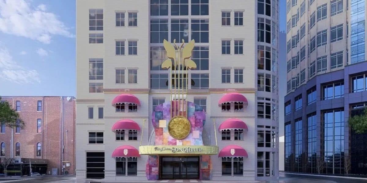 The Hard Rock Hotel entrance with its signature pink awnings and giant gold guitar, framed by impressive city buildings.