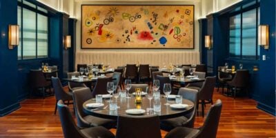 Interior of Bourbon Steak by Michael Mina at the Walt Disney World Dolphin Hotel, featuring its upscale dining room and table settings.