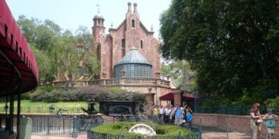 The hearse in front of the Haunted Mansion at the Magic Kingdom