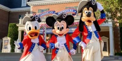Mickey Mouse, Donald Duck, and Goofy in American attire to celebrate 4th of July in Disney World