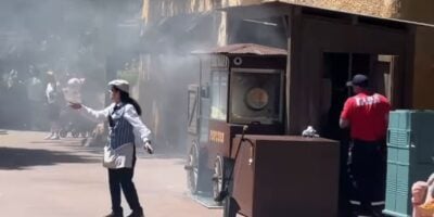A Disneyland Paris cast member directs guests away from a popcorn cart on fire in Frontierland