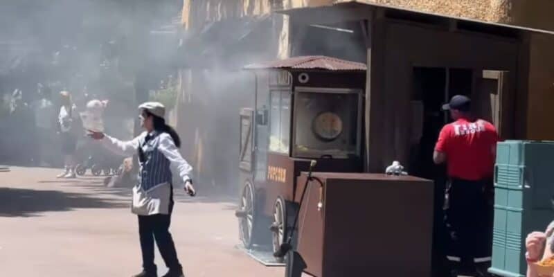 A Disneyland Paris cast member directs guests away from a popcorn cart on fire in Frontierland