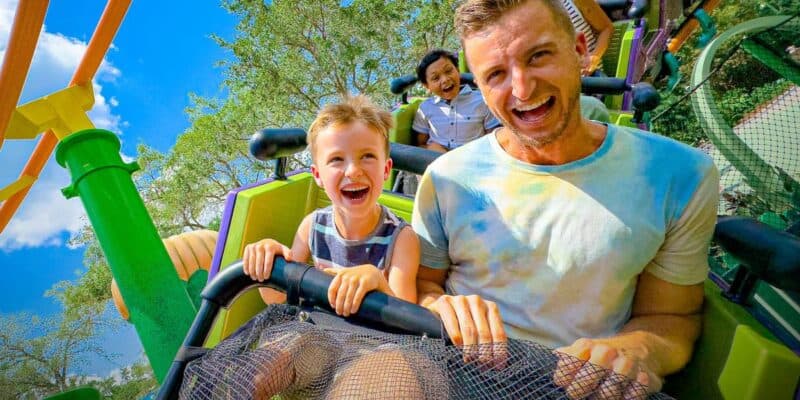 Guests ride a roller coaster at Universal Kids Resort