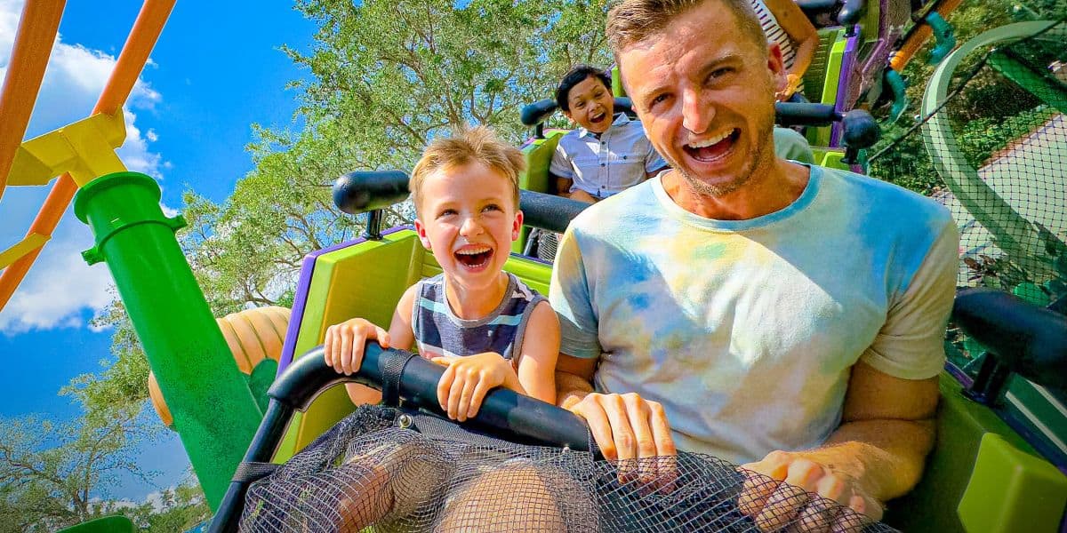 Guests ride a roller coaster at Universal Kids Resort