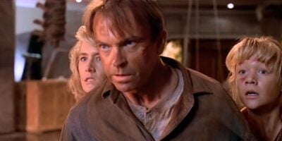 L to R: Ellie Sattler, Alan Grant, and Lex Murphy facing the raptors in 'Jurassic Park'