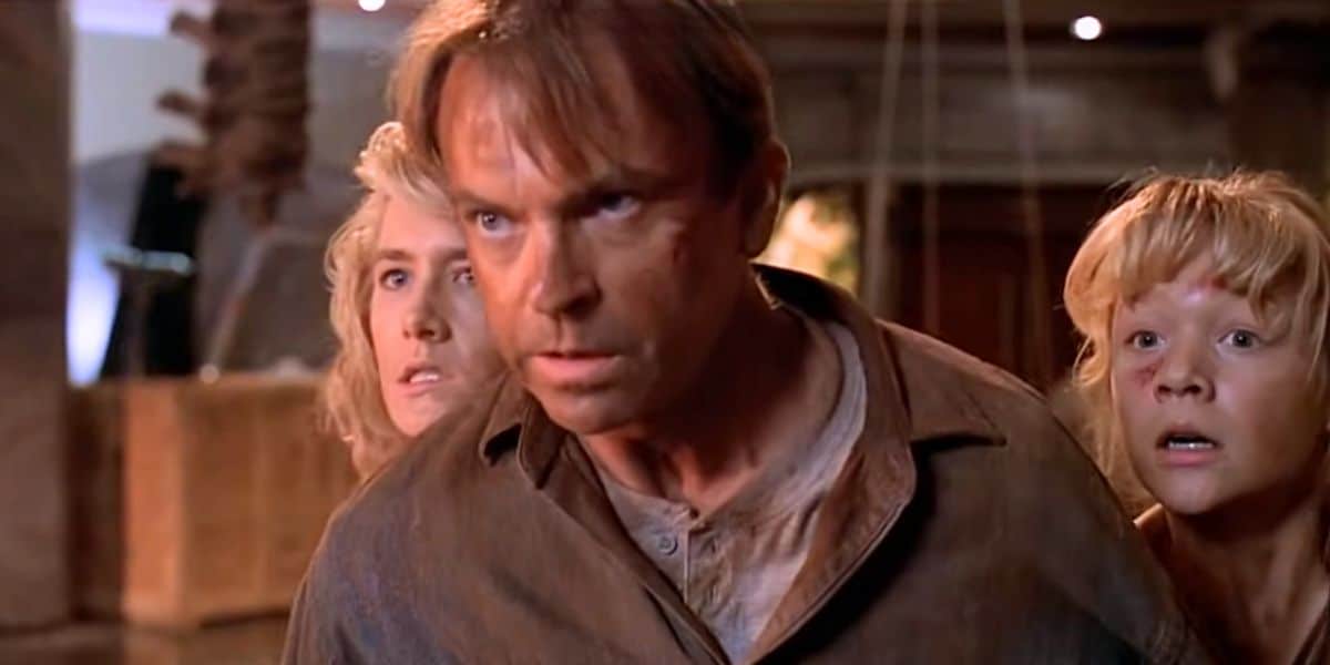L to R: Ellie Sattler, Alan Grant, and Lex Murphy facing the raptors in 'Jurassic Park'