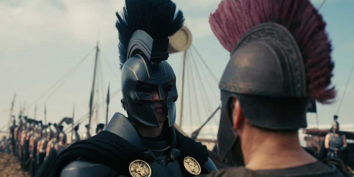 Agamemnon (Benny Safdie) talking to Odysseus (Matt Damon)