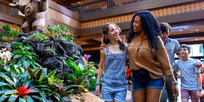Guests walking through Disney's Polynesian Village Resort lobby