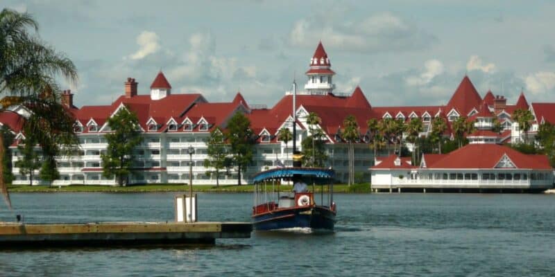 A boat on the Seven Seas Lagoon in front of Disney's Grand Floridian Resort & Spa