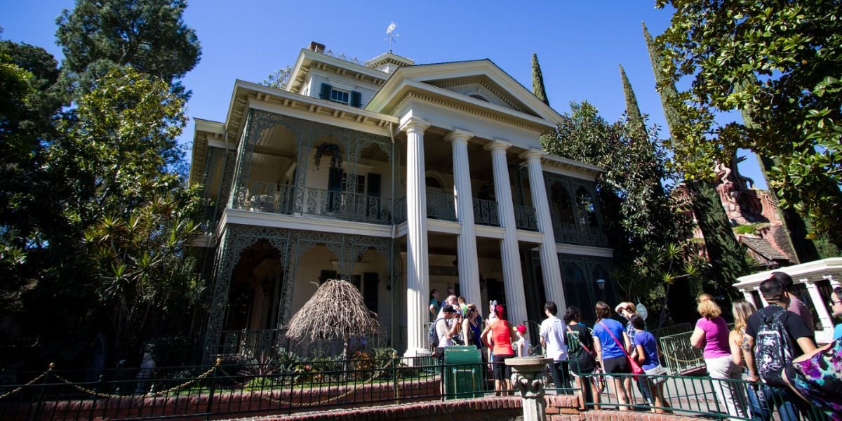 Guests approaching the Haunted Mansion at Disneyland