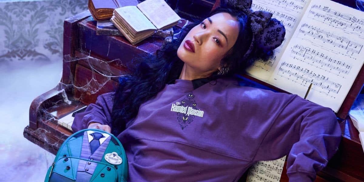 disney world guest showing off haunted mansion merch