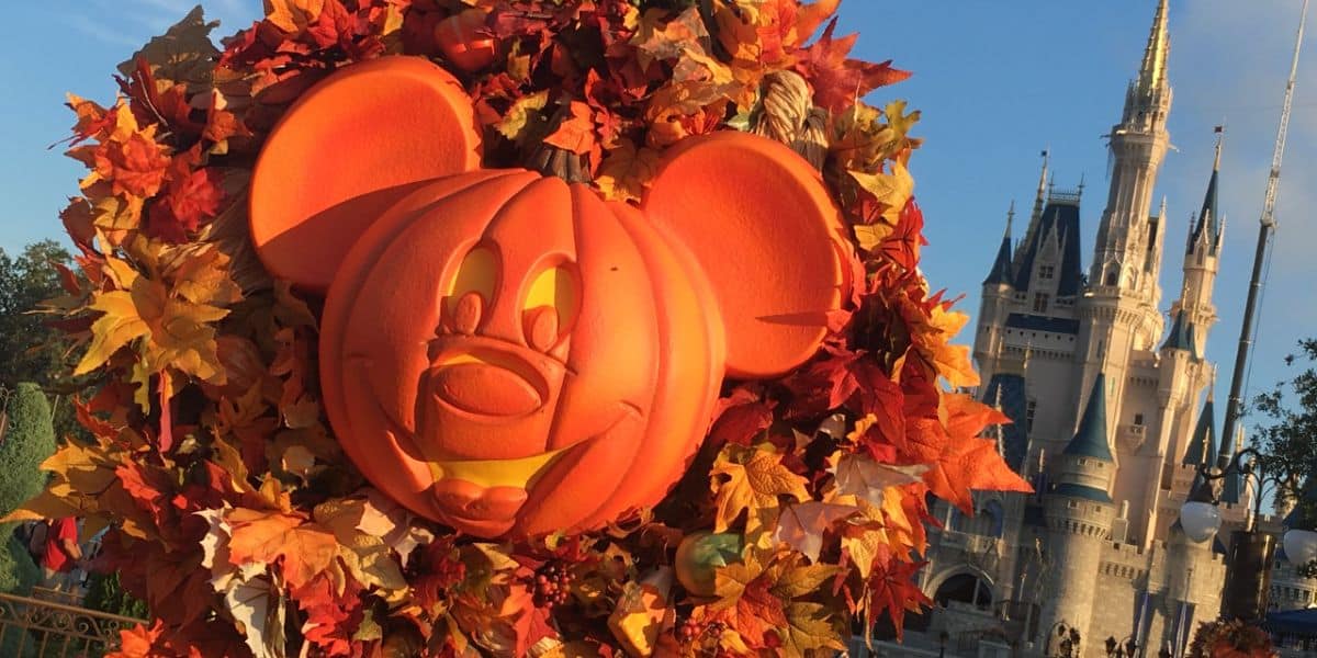 A pumpkin Mickey Halloween decoration in front of Cinderella Castle in Magic Kingdom Park at Walt Disney World Resort.